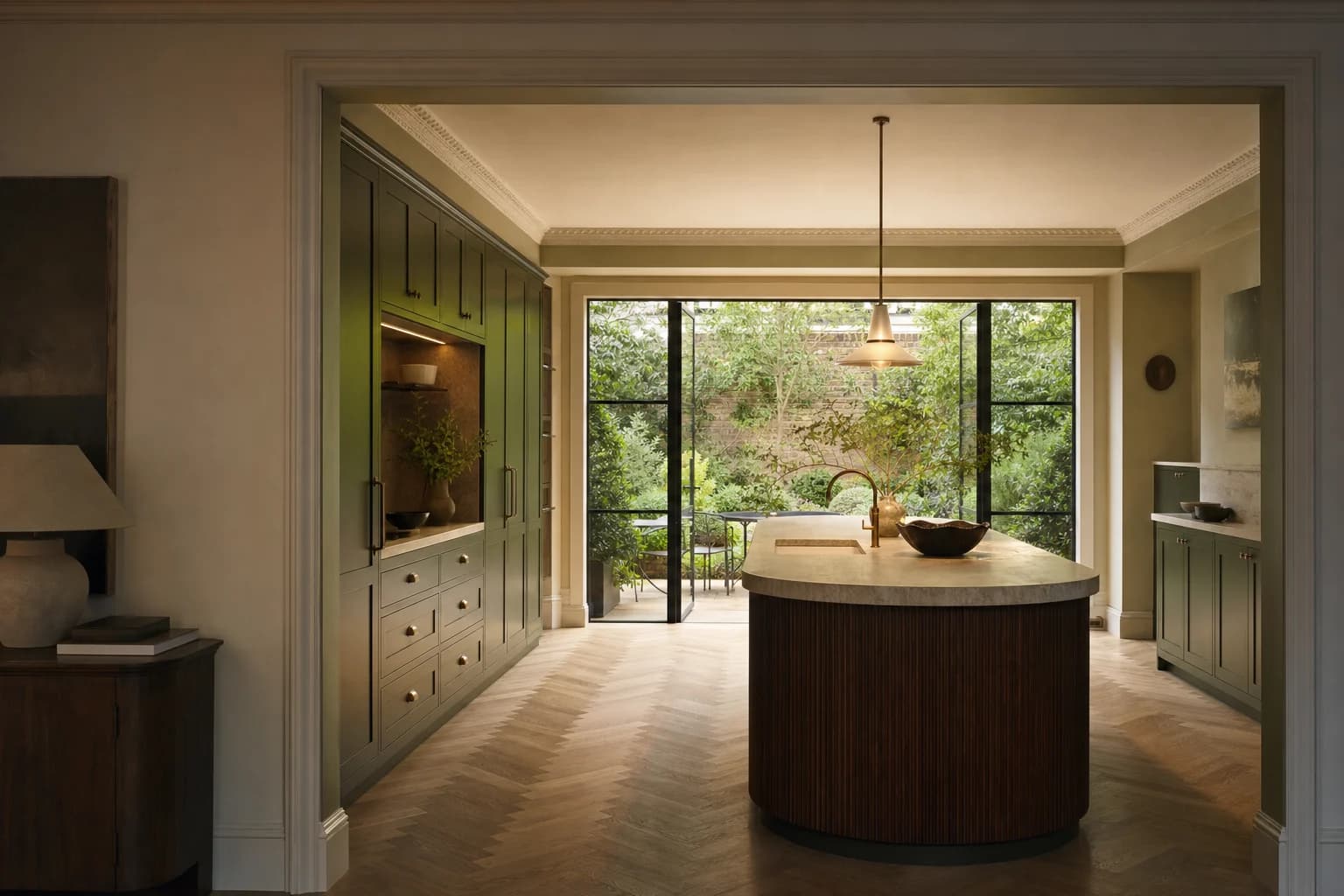 Illustrative completed Chelsea townhouse kitchen with olive cabinetry and a fluted walnut island